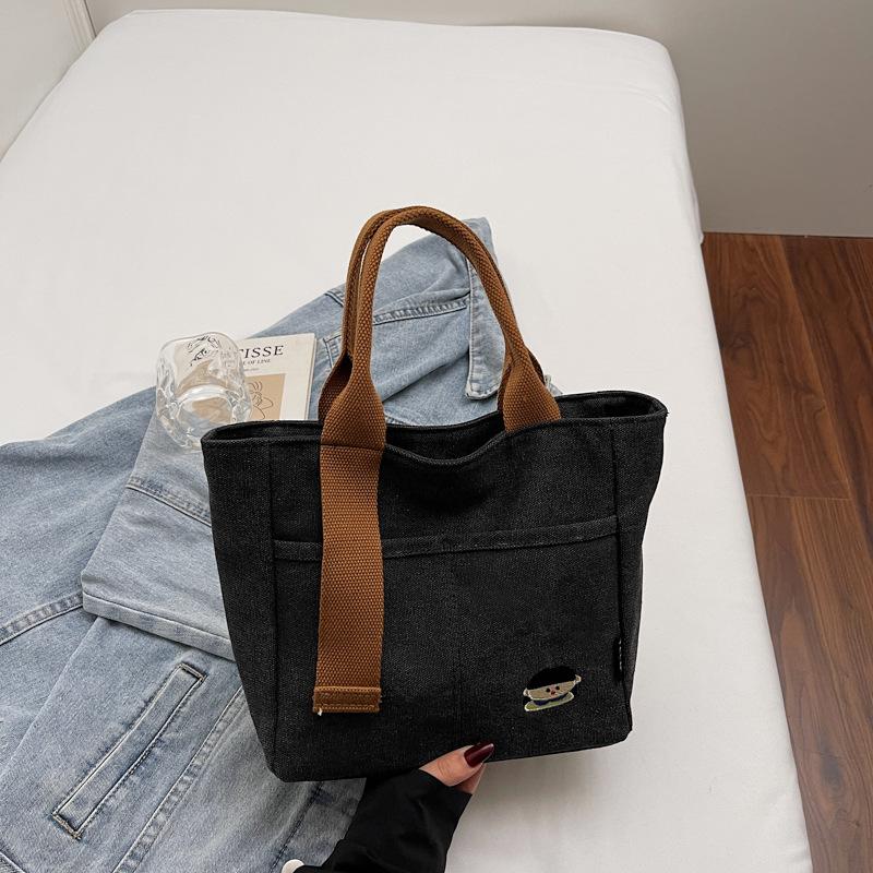 Lightweight canvas bag women's 2025 new autumn and winter leisure college students class portable commuter bag portable bucket bag