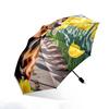 Folding umbrella Dachshund walking among yellow tulips. Creative portable folding umbrella for Christmas and other holiday