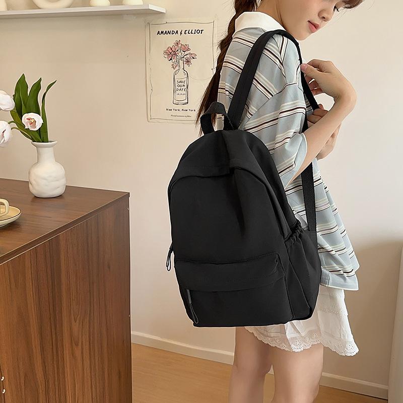 Solid color simple backpack girls' junior high school college student schoolbag large capacity niche versatile design large capacity backpack