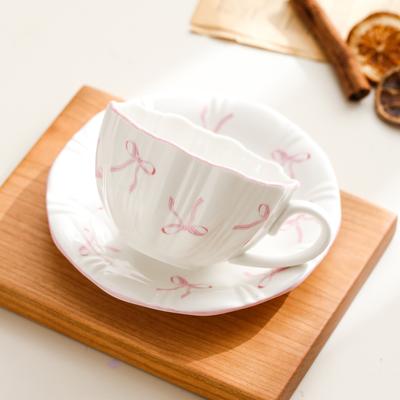 Ins taza de café con lazo lindo transfronterizo de alto valor taza de cerámica platillo hogar corazón de niña taza de té de la tarde taza de agua