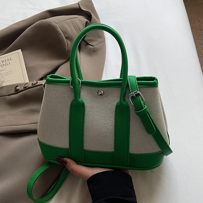 

Wholesale Korean version of casual niche contrasting color portable bucket bag commuting versatile simple personality messenger women s bag