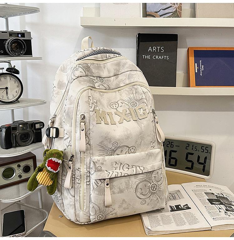 Schoolbag trendy school bag male high school student female graffiti junior high school student backpack college student large capacity lightweight