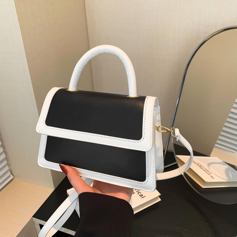 Splicing color clamshell type casual summer new simple Korean version fashionable foreign style women's hand carry shoulder small square bag soft