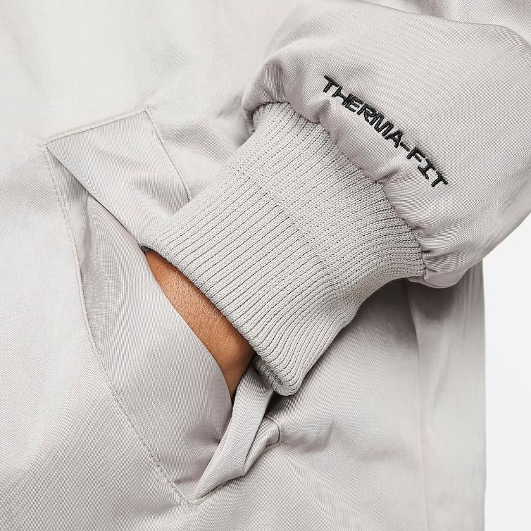 Nike Kurtka damska Air Therma-FIT z syntetycznym wypełnieniem średniej długości, luźna, ciepła, kolor College-Grey DD4641-033