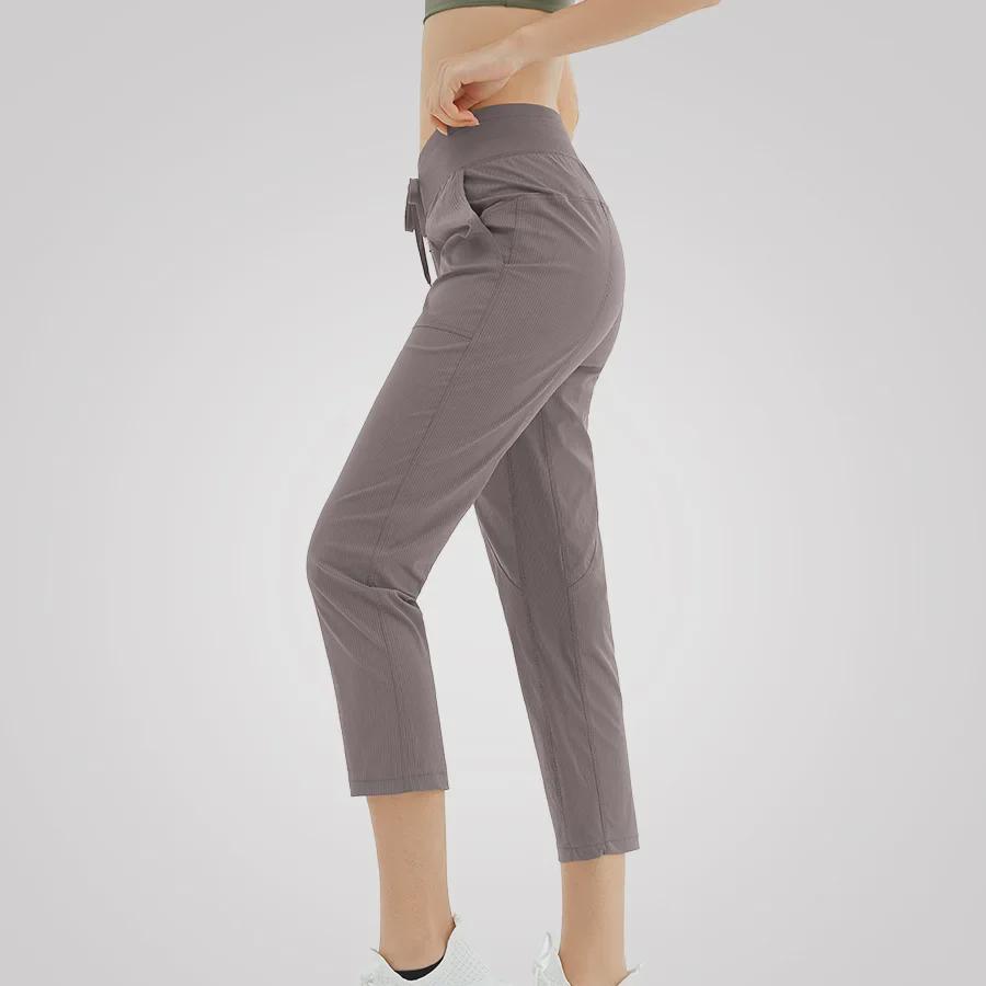 Women's Quick-Dry Yoga Pants: Breathable, Loose-Fit, Nine-Point Length with Drawstring for Running and Fitness.