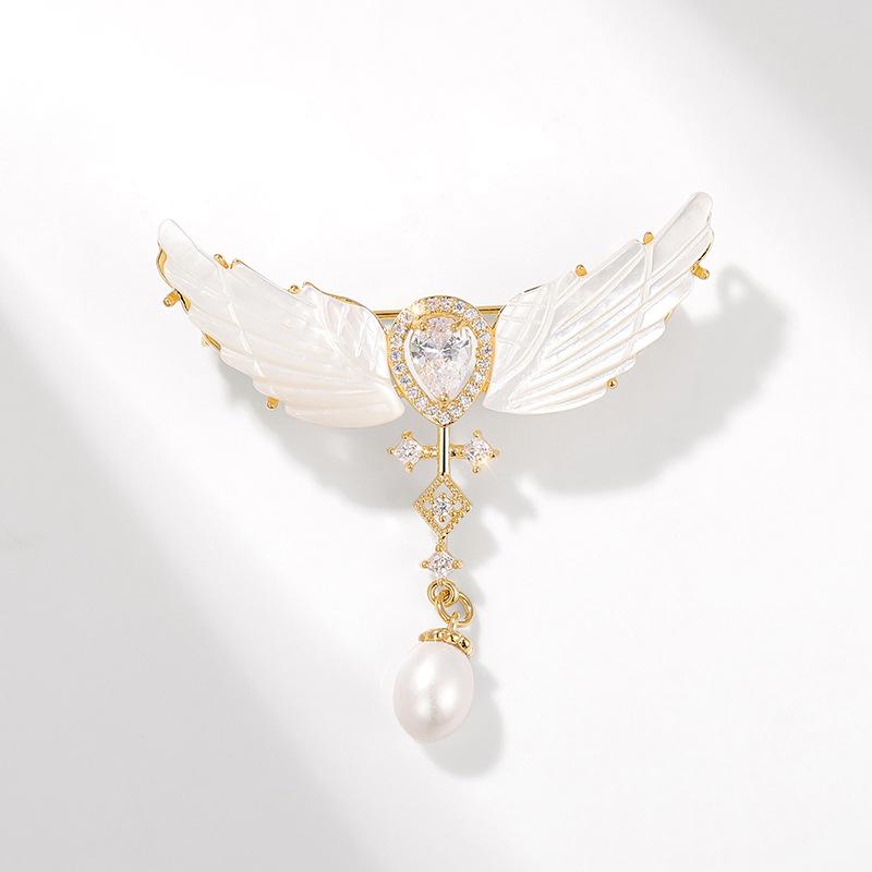 

Брошь «Жемчужина-капля и крылья ангела» с натуральной раковиной морской воды