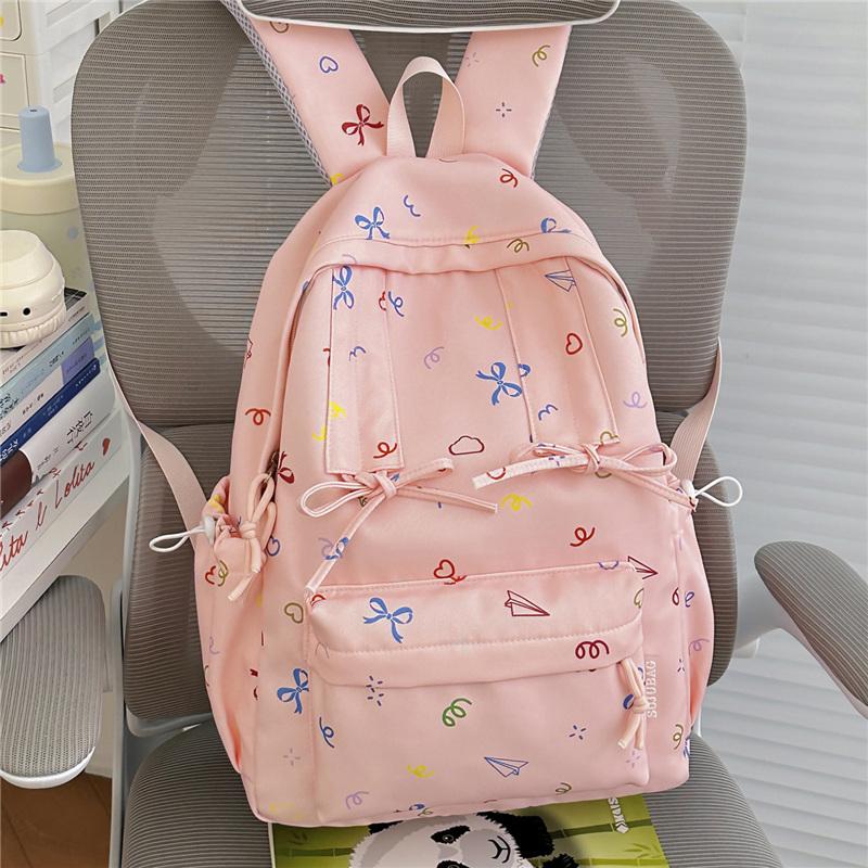 Cute Bow Tie Print School Backpack Lightweight Nylon Zipper Daypack with Front Pocket for Teen Girls Daily Travel
