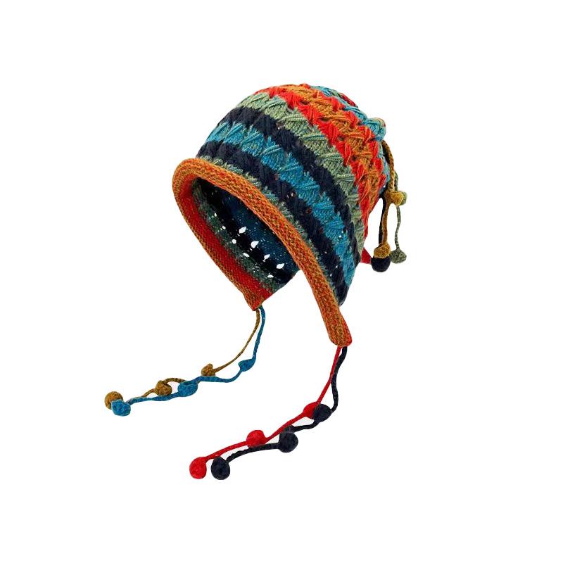 Handmade women's knitted headgear autumn and winter color fringed ball lace-up ear protector hollow knitted wool cap