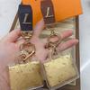 V-Shaped Gold Donkey Keychain with Leather Pendant and Pure Gold Ornament