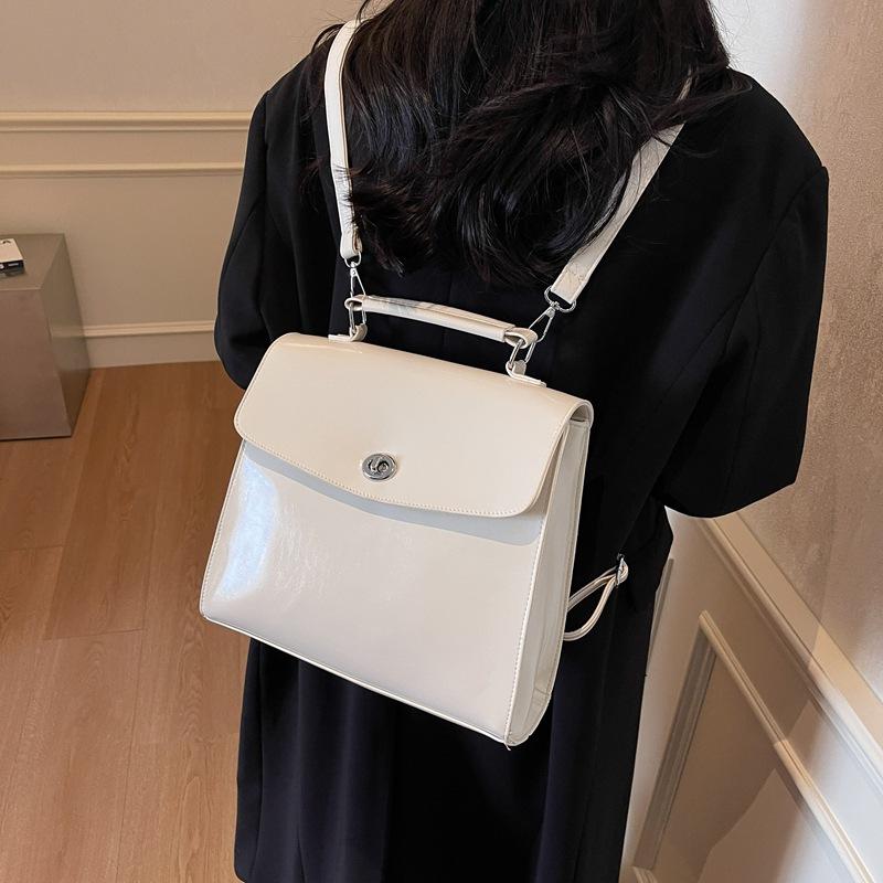 

Весна 2025 новая сумка-тоут из ПУ с масляным воском, нишевый дизайн, дорожный рюкзак 27*10*23 белый