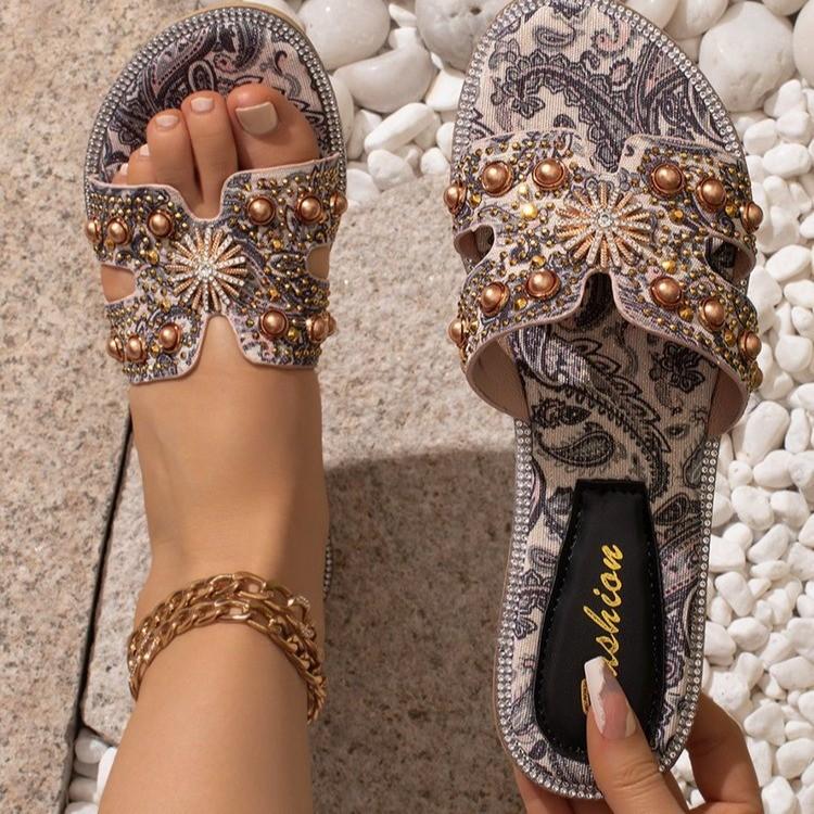 

Сланцы с жемчугом Xiaoxiangfeng женские летние новые для улицы на плоской подошве 2025 новое ощущение для выхода в свет фея отпускные сандалии 36