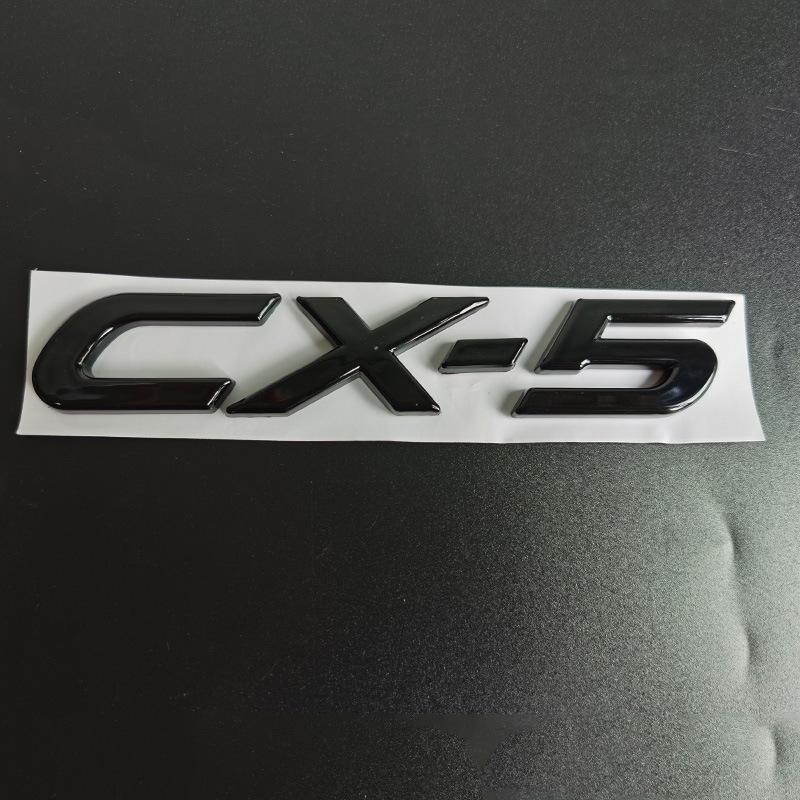 Mazda CX-30, CX-4, and CX-5 Glossy Black Badges: Numerical, Trunk Letter, and Tail Displacement Badges.