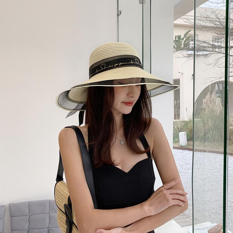 Wide Brim Bucket Hat with Elegant Black Bow - Breathable, Inelastic, and UPF Protective - Perfect for Beach, Travel, and Holiday Outings