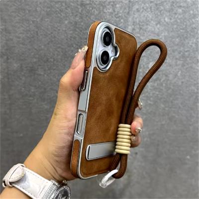Custodia in Pelle Placcata Business per iPhone 16 15 11 12 13 Pro Max 16 Plus Cinghia da Polso Catena da Mano Supporto Pieghevole Cover PC