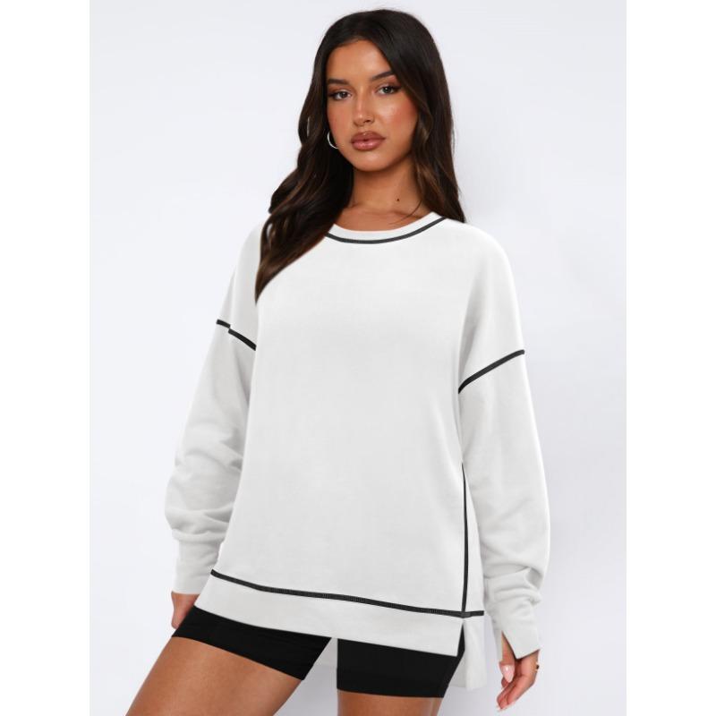 Женский контрастный пуловер свободного кроя с длинными рукавами с разрезами — фото 5