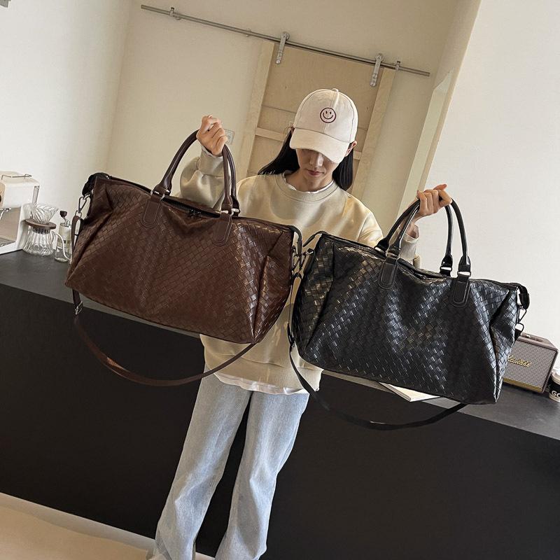New fashion new PU leather woven portable travel bag large capacity shoulder messenger bag casual Korean version travel bag
