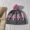 Cute three-dimensional cat jacquard wool hat female winter warm cold ear protection windproof color matching hairball knitted cold hat