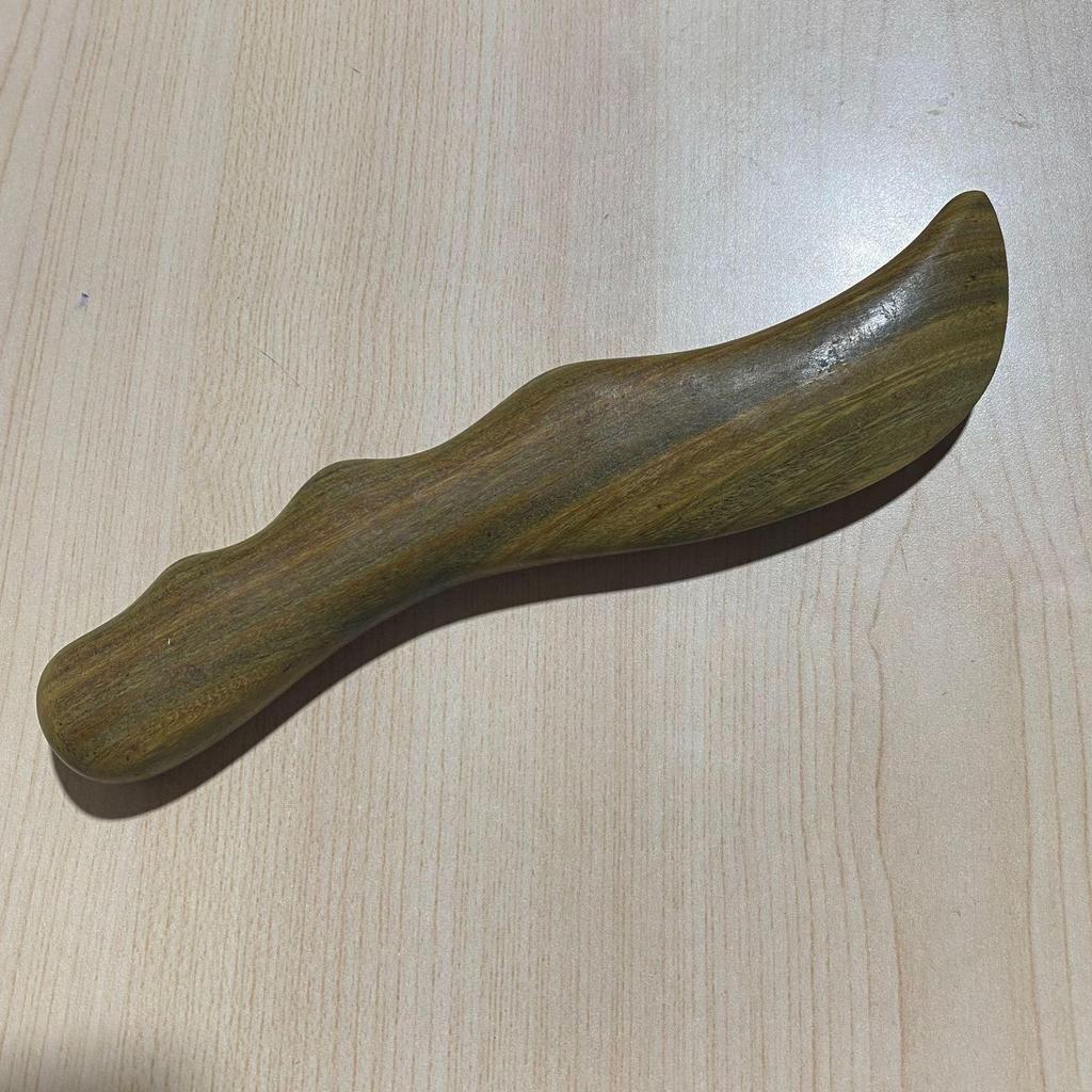 Purple Sandalwood Gua Sha Board for Back Massage and Meridian Scraping.