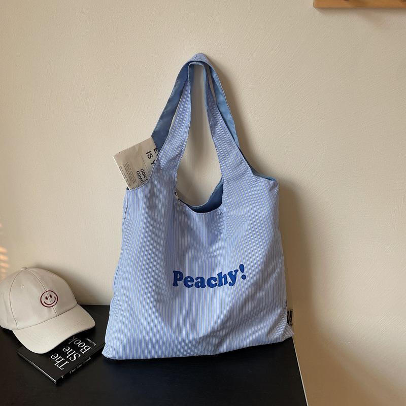 

Single shoulder large capacity nylon bag striped letter printed cloth bag simple versatile fashion niche tote bag women синий