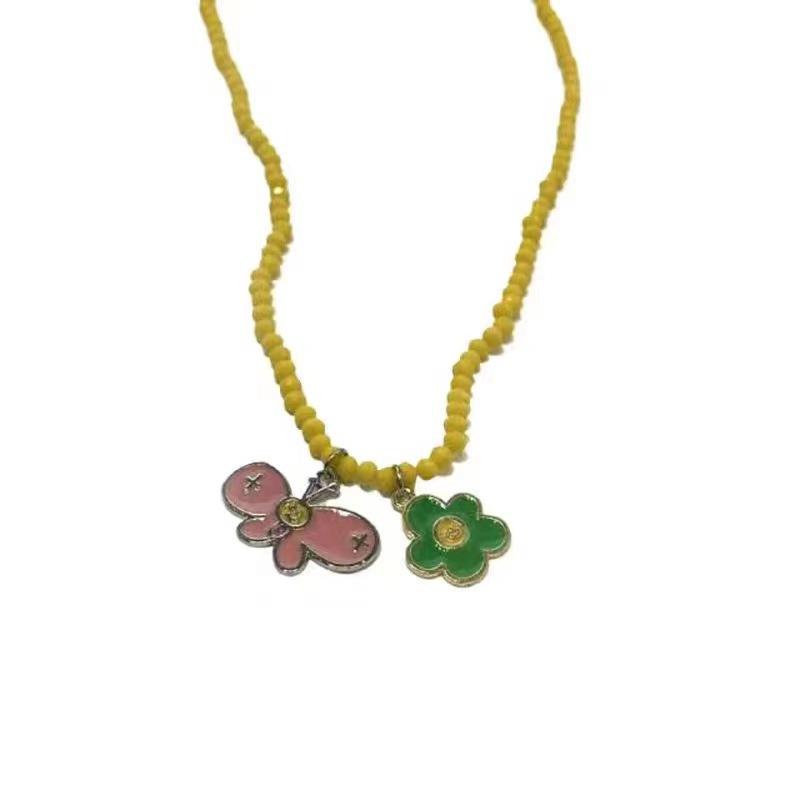 

Small fresh flower butterfly pendant necklace female niche design beaded collarbone chain versatile rice bead neck chain