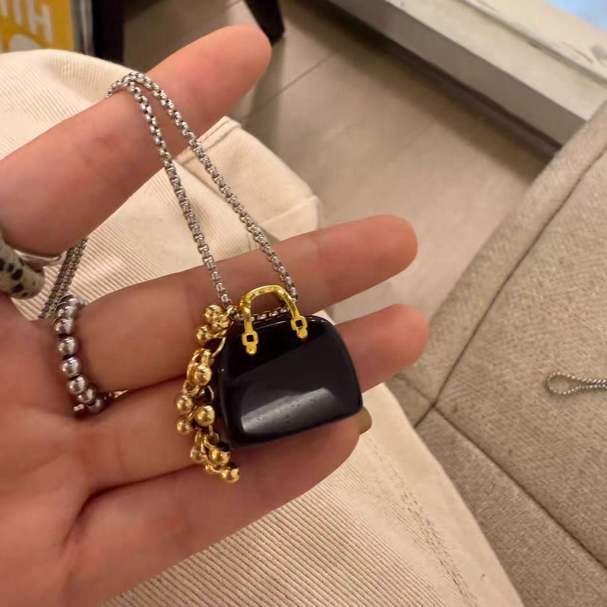 

Korean sweet cool style tiger s eye stone obsidian bag grape string necklace niche design sense versatile sweater chain necklace