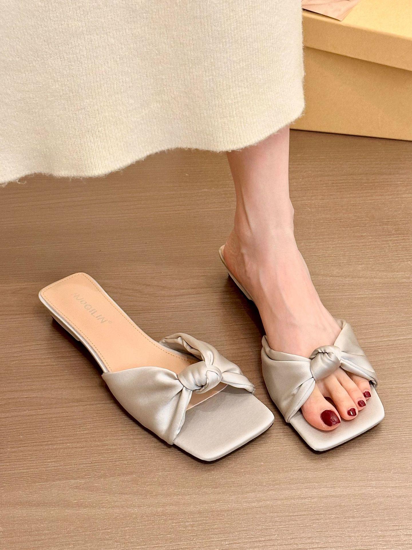 

Peninsula glazed silver! Temperament satin word with knotted sandals women s summer new Korean version open-toed flat sandals 40