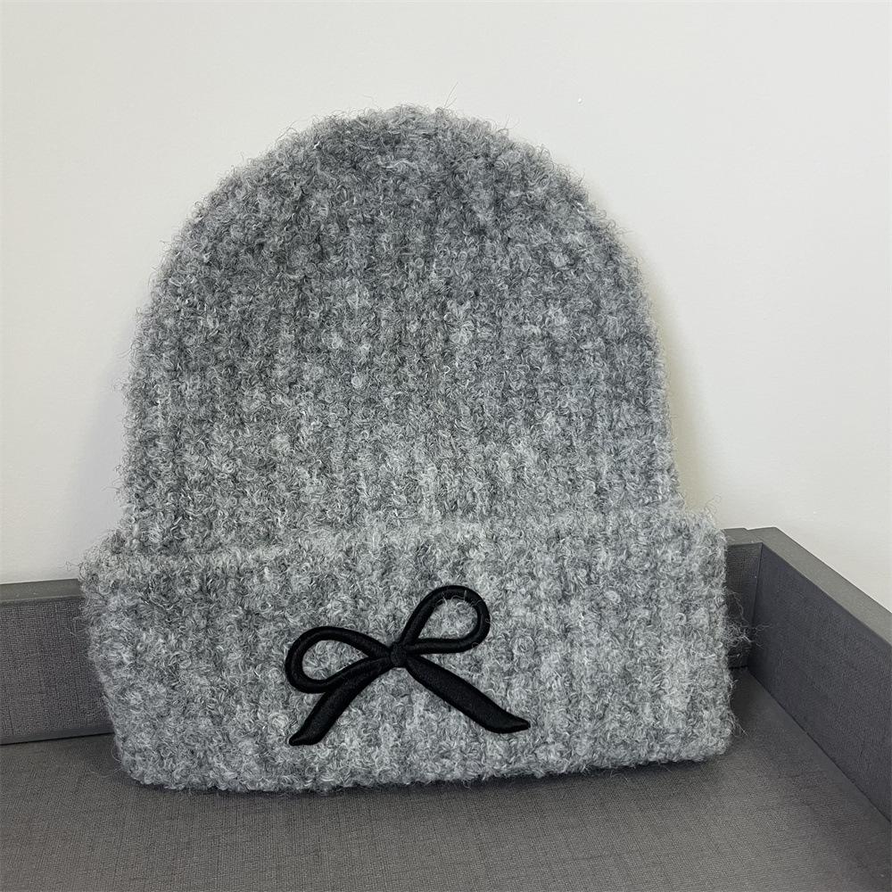 

Шляпа женская осенне-зимняя шерстяная шляпа новая милая бант универсальная теплая шапка с защитой ушей вязаная шапка тренд adult (55-58cm) elastic