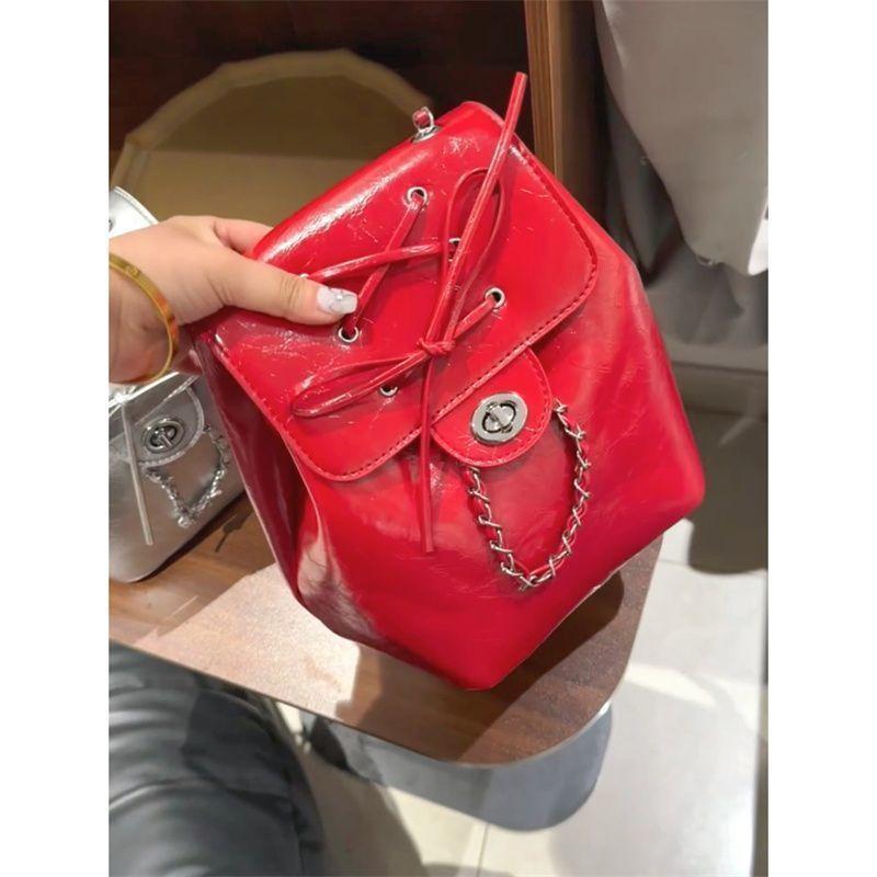 

Versatile chain small fragrance style personality bucket small backpack lazy wind bow fashion high-end red backpack красный