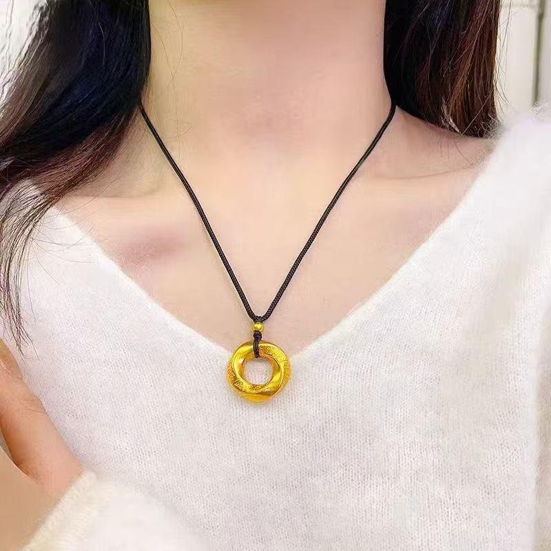 Golden Twist Qiankun Buckle Pendant Necklace - Light Luxury Women s Accessory with Black Cord.