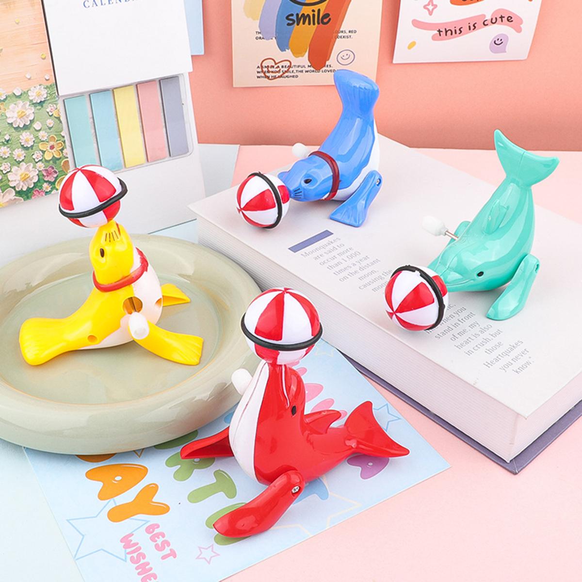 Игрушки для детей Милый заводной морской котик юла Мячик-игрушка Креативный мультяшный заводной дельфин юла Вращающаяся трюковая игрушка Забавные подарки clockwork