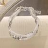 Pearl Womens Bracelet With Irregular Silver Beads And Tassel Accents For A Look Classy