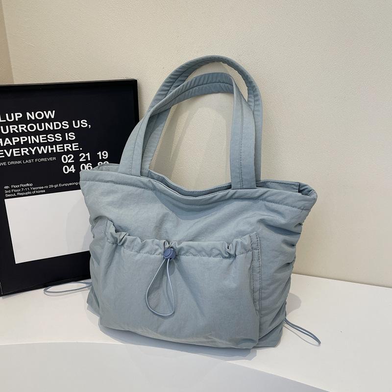 

Large capacity tote bag women s 2025 new trendy casual lightweight commuter bag shoulder pleated drawstring laptop bag 46*16*33 синий