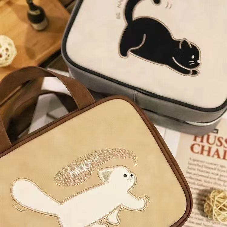 Spacious Cartoon Travel Makeup Bag: Portable, Multi-Compartment, and Three-in-One Design