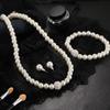 Creative Imitation Pearl Bridal Jewelry Set: Necklace, Bracelet & Earrings with Cross Design