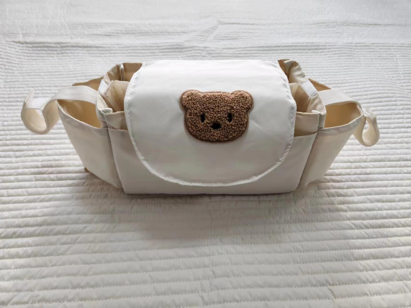 

Portable Cartoon Bear Stroller Bag - Multi-Storage Travel Essential for Moms 36x15x12 cm