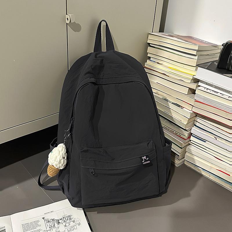 Japanese simple solid color schoolbag female college student casual versatile backpack large capacity junior high school student travel backpack