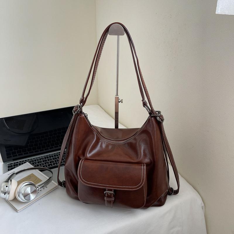 Casual large capacity retro bag women 2025 new versatile shoulder bag double shoulder backpack commuter bucket bag