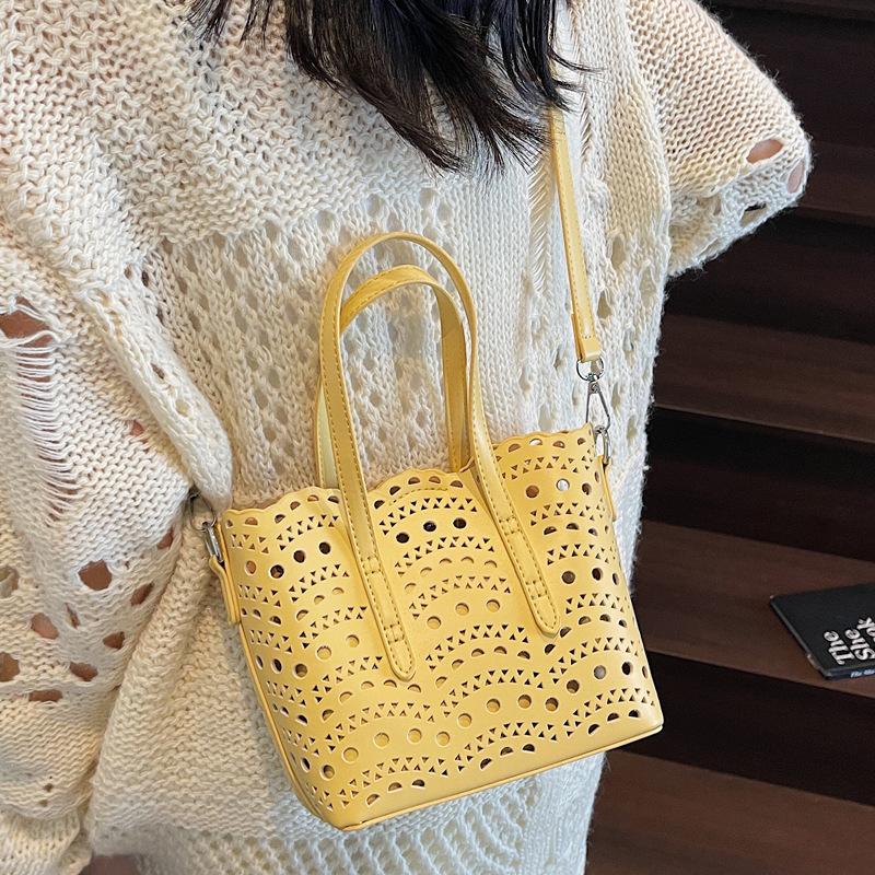 High-end carved hollow portable small bag women's 2025 new fashion texture bucket bag single shoulder messenger bag tide