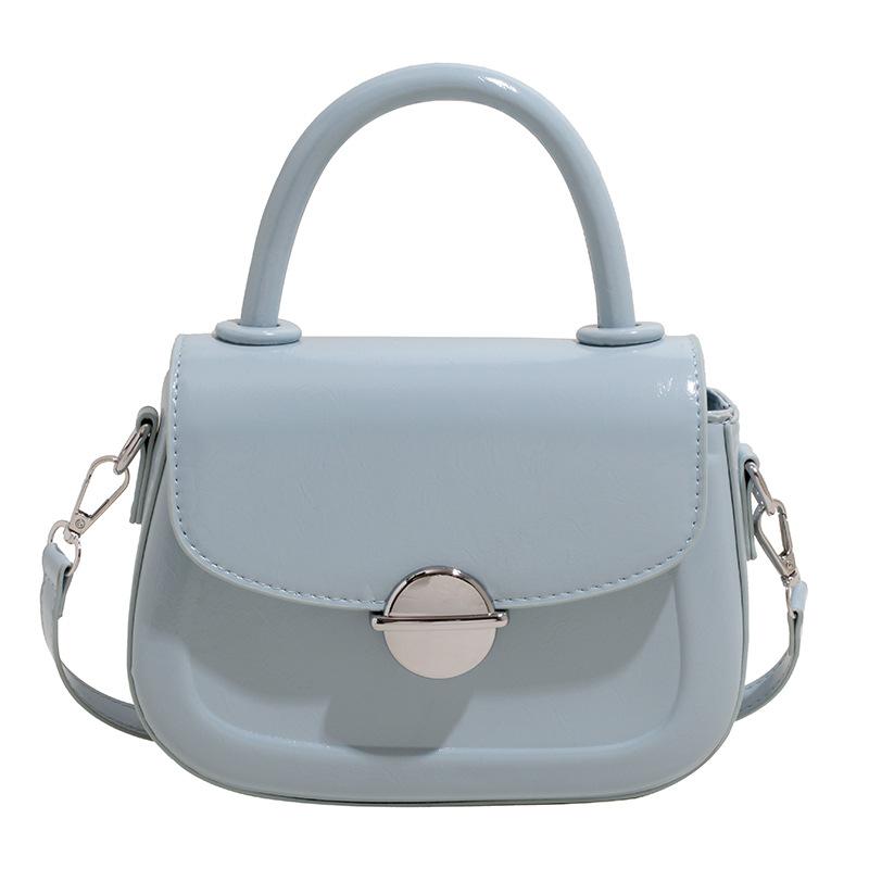 

Spring and summer new fashion Ou Ruofeng simple oil wax leather portable saddle bag versatile casual commuting foreign style messenger bag синий