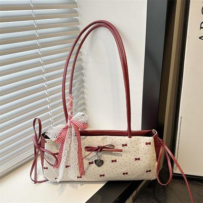 Zomer mode veelzijdig zoete strik okseltas dames eenvoudige niche high-end schouder handtas
