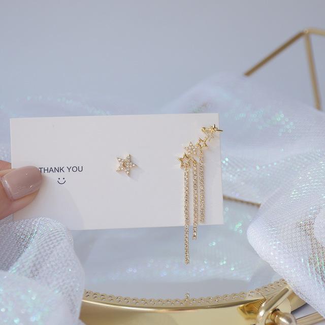 

Изысканные медные инкрустированные циркониевые асимметричные серьги-клипсы в форме звезды с кисточками из настоящего золота 14 карат для женщин, подарочные серьги из Кореи белый