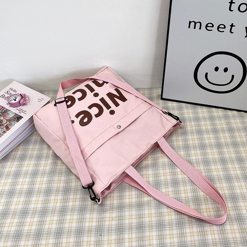 Stijlvolle studententote bag met grote capaciteit, nieuwe handtas met textuur, trendy schouder-okseltas.