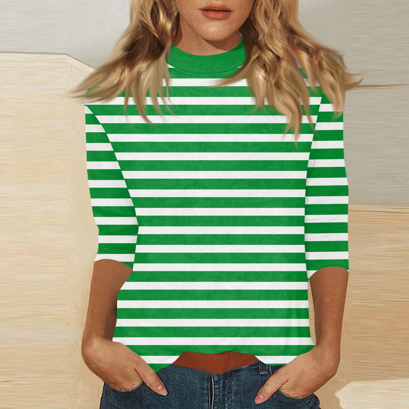 

Жіночий топ з високим коміром та рукавом 3/4 з принтом XL зелений