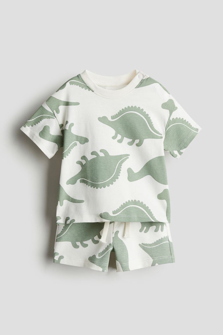 

Комплект из топа и шорт HM Кремовый с динозавром