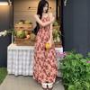 Seaside vacation floral suspender dress women's summer 2026 new Hong Kong style retro chic small man long skirt