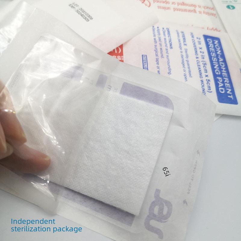 First Aid Kit Accessories: Non-Stick Absorbent Pads and Band-Aids for Wounds