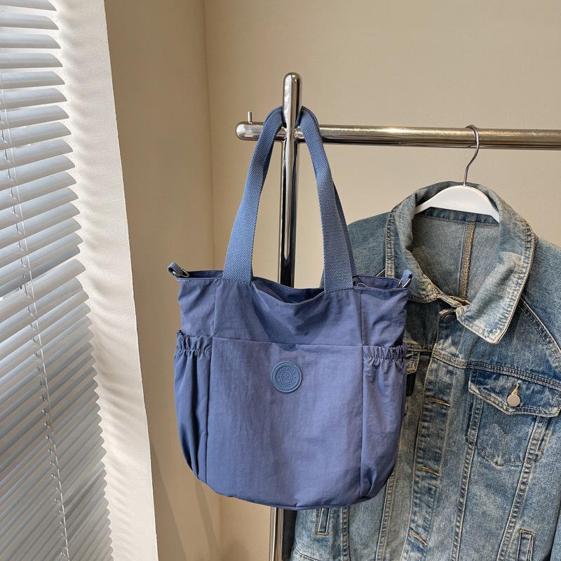 

Large-capacity bag women s new spring and summer casual shoulder messenger bag texture class commuter tote bag синий