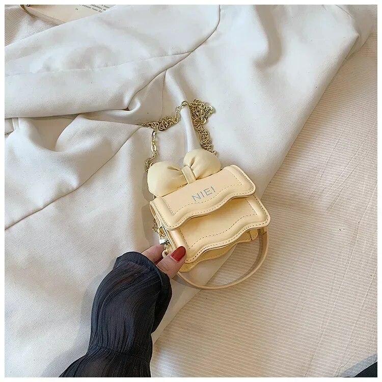 

Милая мини-сумка на цепочке для женщин и девочек, ежедневная сумка для наушников, губной помады, брелок для ключей, новая модная сумка через плечо с бантом ярких цветов жёлтый