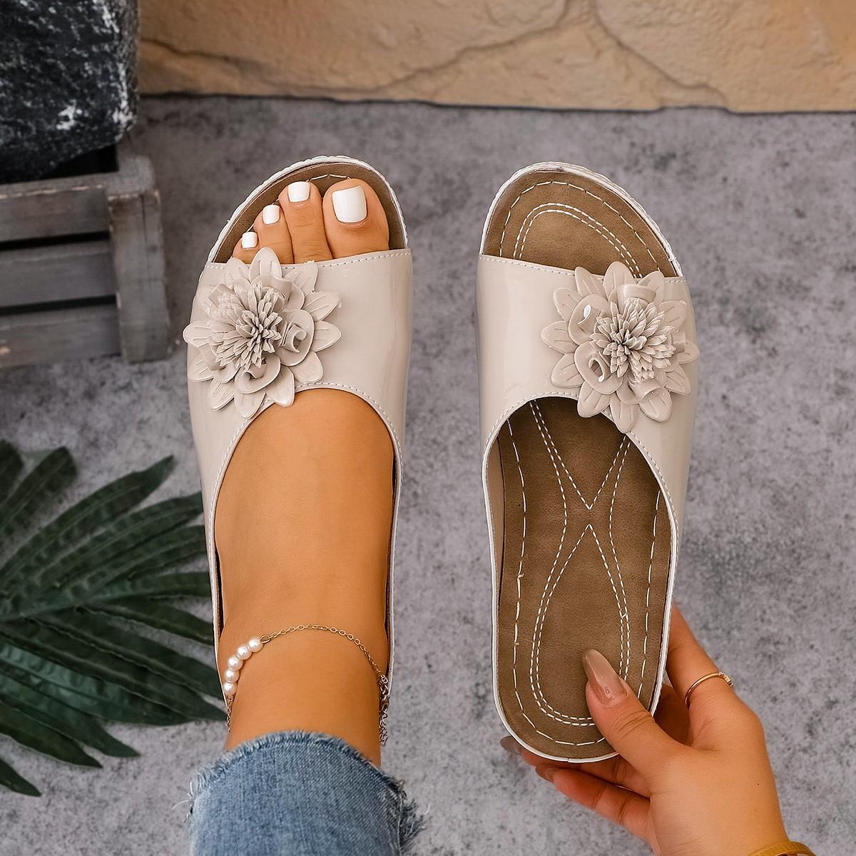 

2025 spring and summer new slope heel open-toed outer wear one-word slippers women s European and American flowers flat-bottomed thick-bottom 43