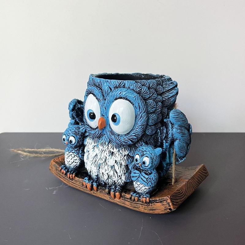 An Owl Hanging A Succulent Decoration In A Flower Pot As A Gift